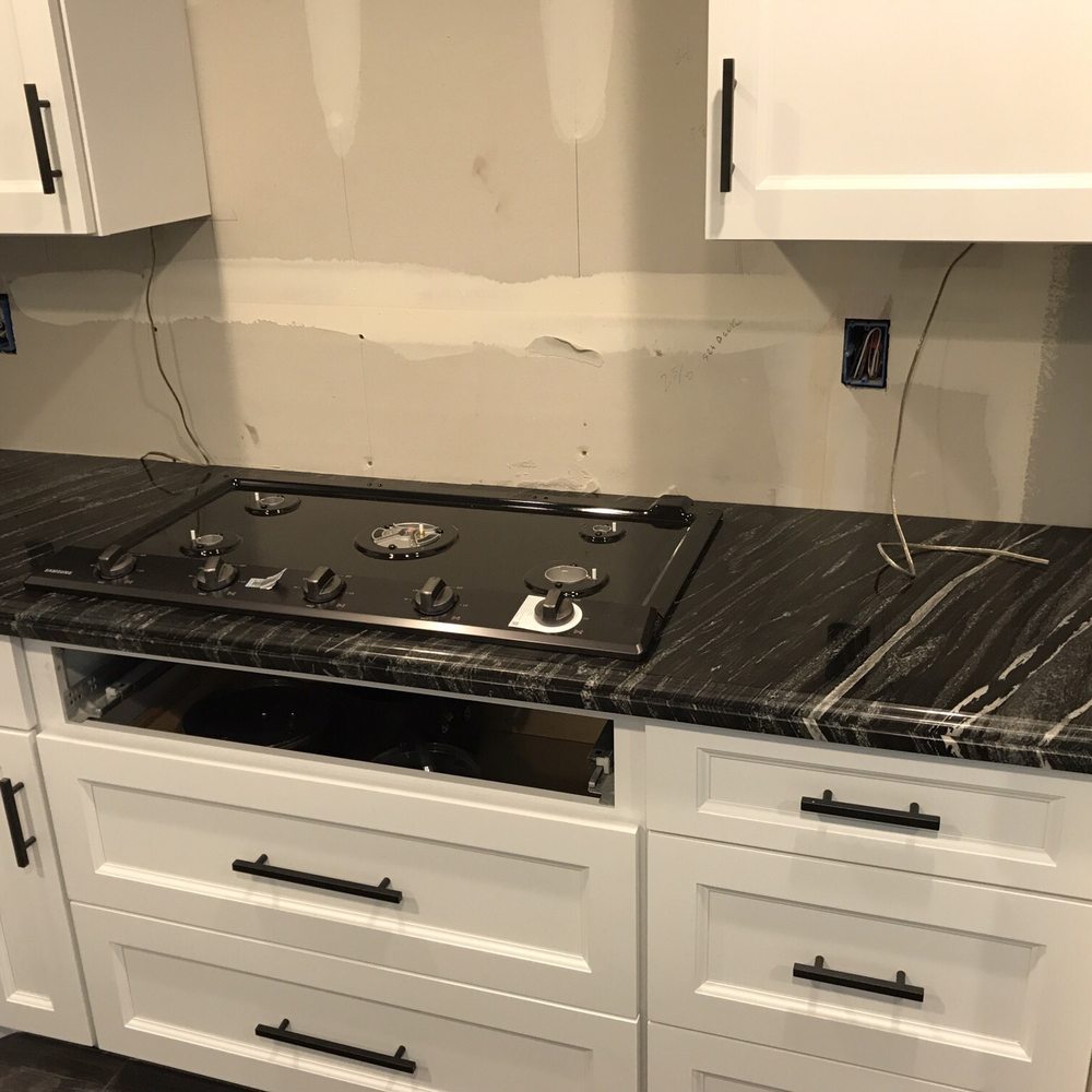 A&A Granite Creations - a kitchen counter with a stove - General Contractors Near Me - Morgan Hill, California A&A Granite Creations - a kitchen counter with a stove - General Contractors Near Me - Morgan Hill, California