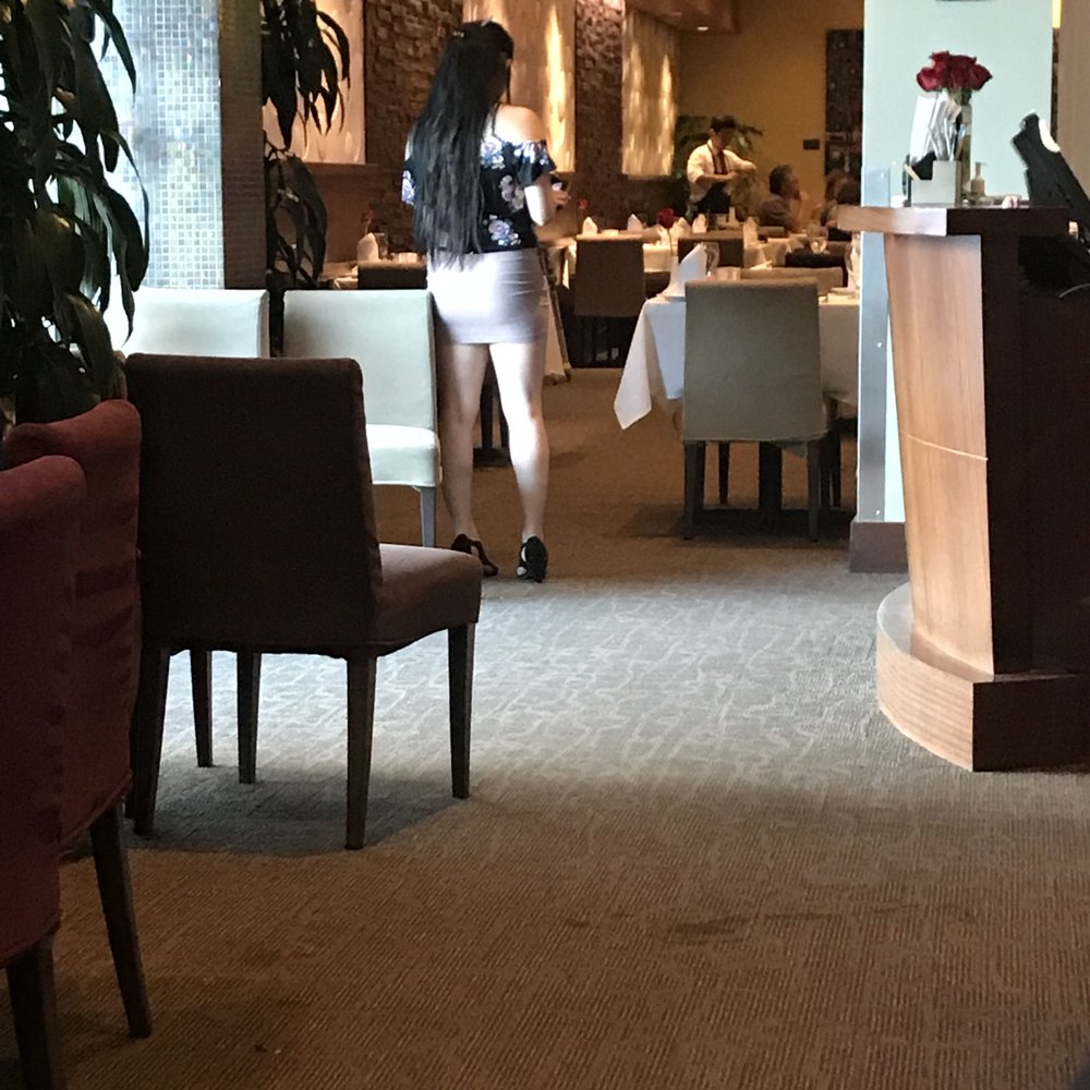 Assaggio Bistro - A Hostess for a higher end restaurant should not be dressed like this. Short/tight skirt with a tight "cutout" blouse. - Italian Near Me - Honolulu, Hawaii Assaggio Bistro - A Hostess for a higher end restaurant should not be dressed like this. Short/tight skirt with a tight "cutout" blouse. - Italian Near Me - Honolulu, Hawaii