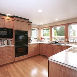 Double J Construction Inc - crown molding, dual oven, black appliances, down draft vent, laminate counter top, hardwood flooring, Milgard windows