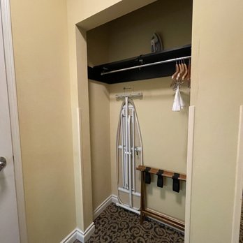 Plaza Inn and Suites - Open-closet with iron board and iron, hangers, etc. - Hotels Near Me - Ashland, Oregon