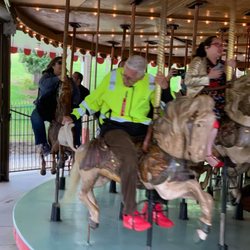 Waltland Disney History Bus Tour - Bob Gurr being fun on the Carousel