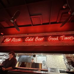 Hot Tomato Italian Restaurant & Brick Oven - Love the sign! They live by this motto!!