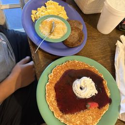 Ducks choice, cheese grits, scrambled eggs, sausage, & blueberry pancake Ducks choice, cheese grits, scrambled eggs, sausage, & blueberry pancake