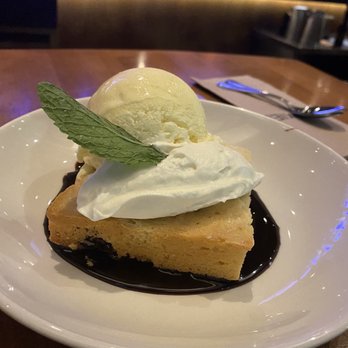 Moxies Square One Restaurant - A moxies must, white chocolate brownie - Canadian (New) Near Me - Mississauga, Ontario Moxies Square One Restaurant - A moxies must, white chocolate brownie - Canadian (New) Near Me - Mississauga, Ontario