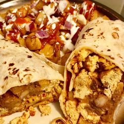 El Patron Taqueria - Breakfast burrito with chorizo egg with a side of potatoes