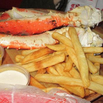 Bob Chinn's Crab House - 20 oz. Alaskan King Crab Legs with French Fries (pictured is my Mom's hand as reference to the size of the crab legs) - Seafood Near Me - Wheeling, Illinois Bob Chinn's Crab House - 20 oz. Alaskan King Crab Legs with French Fries (pictured is my Mom's hand as reference to the size of the crab legs) - Seafood Near Me - Wheeling, Illinois