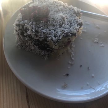 Good Day Deli - Lamington -- super dry and lacking signature texture. It's not supposed to simply be a slice of dry sponge roles in coconut. - Cafes Near Me - Cork, Colorado Good Day Deli - Lamington -- super dry and lacking signature texture. It's not supposed to simply be a slice of dry sponge roles in coconut. - Cafes Near Me - Cork, Colorado