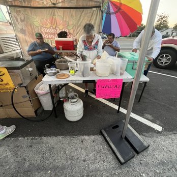 Delicious Strawberries and More - a group of people sitting under a tent - Shaved Ice Near Me - Long Beach, California