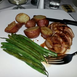 Capitol Bar & Grill - Seared duck breast with a currant demi glaze, garlic string beans and herb roasted red potatoes.