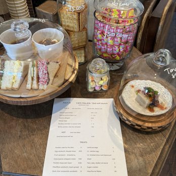 Malaya Tea Room - Ordering counter with eye catching display of menu items and other treats! - Tea Rooms Near Me - Alameda, California