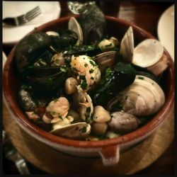 Olar Meu - Mariscada salsa verde - seafood stew (clams, mussels, shrimp, scallops) in green sauce, with Spanish saffron risotto