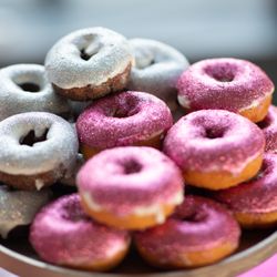 The Cupcake Bar - Tray of silver and pink glitter donuts at a promotional event in Austin, Texas