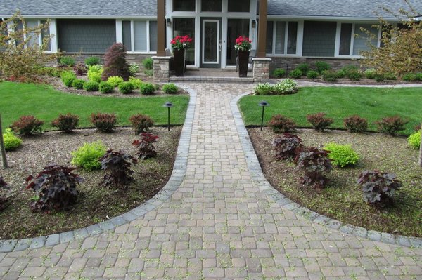 Landscaping - Transform your home's curb appeal with our expert landscaping services! This beautiful front yard features a custom-designed walkway with elegant stone pavers, perfectly manicured greenery, and low-maintenance shrubs, all arranged to enhance the home's natural beauty. With attention to detail and a focus on creating serene, welcoming outdoor spaces, we ensure that every landscape we design is both functional and visually stunning. Contact us to create your dream outdoor environment! Landscaping - Transform your home's curb appeal with our expert landscaping services! This beautiful front yard features a custom-designed walkway with elegant stone pavers, perfectly manicured greenery, and low-maintenance shrubs, all arranged to enhance the home's natural beauty. With attention to detail and a focus on creating serene, welcoming outdoor spaces, we ensure that every landscape we design is both functional and visually stunning. Contact us to create your dream outdoor environment!