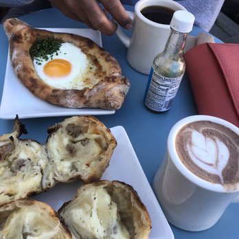 Haddon Hill Cafe - Black coffee, hit chocolate, cheese & sausage stuffed pastry and pizza-like pastry with chives, an egg and Parmesan cheese - Coffee & Tea Near Me - Oakland, California