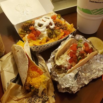 Del Taco - Queso Fries in back, Fish Taco w/ lime on right and the "Free" beef soft taco on left. Remember, served COLD  :( - Tacos Near Me - Lawrenceville, Georgia
