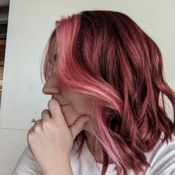 Drift Salon - Rich, multidimensional cool red with a pink money piece. She added some pink highlights underneath for dramatic effect when I wear it up!