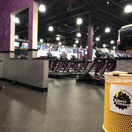View of treadmills, elliptical, bikes with tv area. View of treadmills, elliptical, bikes with tv area.