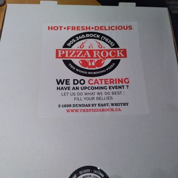 The Pizza Rock - a pizza box on a table - Pizza Near Me - Whitby, Ontario The Pizza Rock - a pizza box on a table - Pizza Near Me - Whitby, Ontario