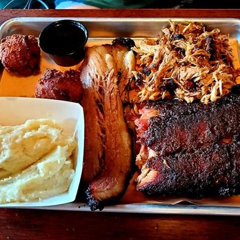Center Street Smoke House - 3 meat combo with smashed potatoes and hush puppies - Barbeque Near Me - Batavia, New York