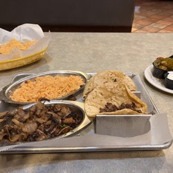 Tacos De Carne Asada, Mushrooms and Spanish Rice!  Side of cilantro with onions, jalapeños, sour cream & salsa verde!!