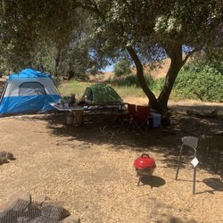 Salt Springs Valley Reservoir & Campground - Our camp site came with 2 fire pits and a bench table. Good amount of shade not packed like most places in the area (woodward, camanche)