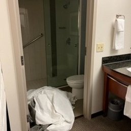 Room # 1 - No upright mattress would be complete without the bedding be piled up in the bathroom floor Room # 1 - No upright mattress would be complete without the bedding be piled up in the bathroom floor
