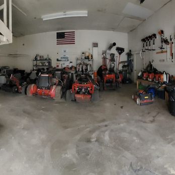 Candid Land Maintenance - a garage full of tools - Lawn Services Near Me Candid Land Maintenance - a garage full of tools - Lawn Services Near Me