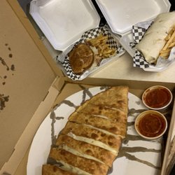 Foutch's Pub - Take out. Large Stromboli, Reuben and pub wrap both with seasoned fries. Yum!