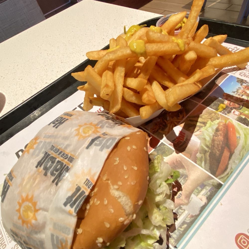 Delicious charbroiled hamburger and fries