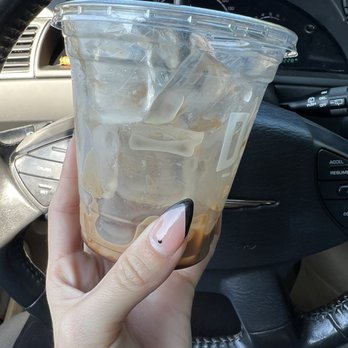 Associated Espresso - a hand holding a cup of iced coffee - Coffee & Tea Near Me - South Hill, Washington Associated Espresso - a hand holding a cup of iced coffee - Coffee & Tea Near Me - South Hill, Washington