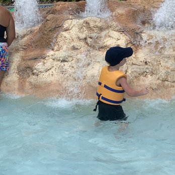 Aquatica Orlando - Lil man trying to figure out how to get on top of that rock ‍ - Water Parks Near Me - Orlando, Florida