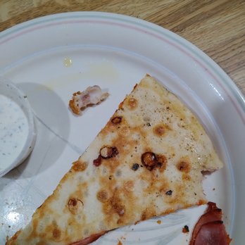 Tornado's Pizza - two slices of pizza on a plate - Pizza Near Me - Belleville, Michigan