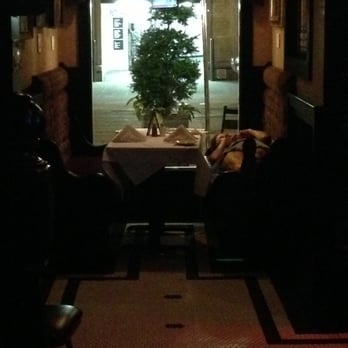 Hurley's - The restaurant's hostess taking up a booth for her loud personal cell phone conversation. - Pubs Near Me - New York, New York