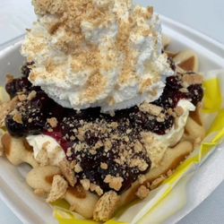 Warped Waffle - Blueberry Delight
Cheesecake, blueberry pie filling, whipped cream, graham cracker crumble