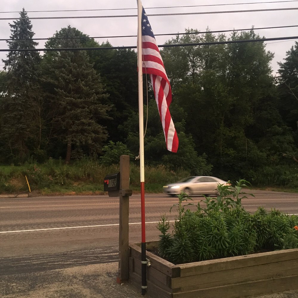 Love the Flag flying out front!