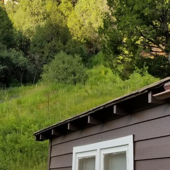 Big Springs Rental Cabins - The cliff behind the lodge where the spring flows - Hotels Near Me - Fredonia, Arizona