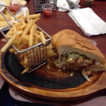 Old Cuban Cafe - Half of the lechon asado sandwich! - Cafes Near Me - Orlando, Florida Old Cuban Cafe - Half of the lechon asado sandwich! - Cafes Near Me - Orlando, Florida
