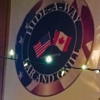 The Hide-A-Way Bar - ows a canadian and canadian flag - Bars Near Me - Mancelona, Michigan The Hide-A-Way Bar - ows a canadian and canadian flag - Bars Near Me - Mancelona, Michigan