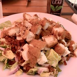 The Quick Fixx - Junk salad (romaine, tomato, cucumber, red onion, bacon, feta, and fried chicken, tossed with Parmesan Peppercorn Ranch)