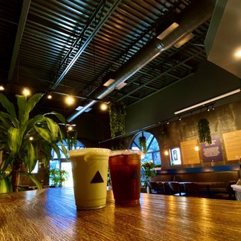 Cafe Blue - Matcha Latte and Cold Brew with a view of the dining area - Coffee Roasteries Near Me - Duluth, Georgia
