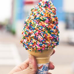 an ice cream cone with sprinkles an ice cream cone with sprinkles