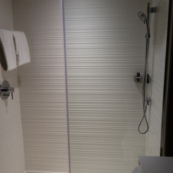 AC Hotel Phoenix Tempe/Downtown - Shower, there's also a rainfall option from the roof if you can figure out the switch. - Hotels Near Me - Tempe, Arizona AC Hotel Phoenix Tempe/Downtown - Shower, there's also a rainfall option from the roof if you can figure out the switch. - Hotels Near Me - Tempe, Arizona