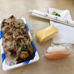 Takoyaki and a piece of salmon and tamago Takoyaki and a piece of salmon and tamago