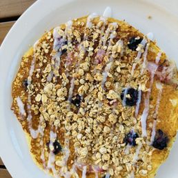 The pancake special with granola and blueberries The pancake special with granola and blueberries