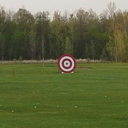 Win $100 . Hit ball through the bulls eye.
