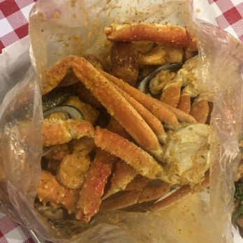 Lowcountry South Loop - King crab, snow crab, mussels, shrimp, corn, sausage, and potatoes accompanied by the everything sauce at a level 1 heat. - Cajun/Creole Near Me - Chicago, Illinois Lowcountry South Loop - King crab, snow crab, mussels, shrimp, corn, sausage, and potatoes accompanied by the everything sauce at a level 1 heat. - Cajun/Creole Near Me - Chicago, Illinois