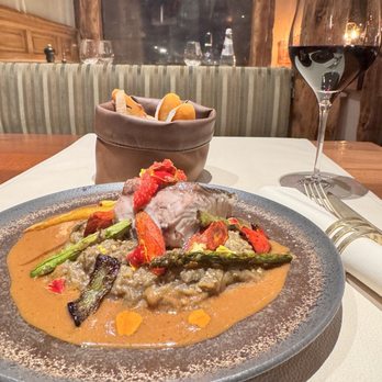 Le Pré aux Clercs - Grilled fresh amberjack on the bed of vegetables - Italian Near Me - Brussels, BRU Le Pré aux Clercs - Grilled fresh amberjack on the bed of vegetables - Italian Near Me - Brussels, BRU