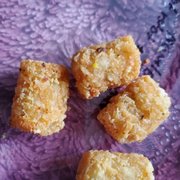 Photo of Wood-n-Tap Bar & Grill- Hartford - Hartford, CT, United States. Tater tots (second side with salmon; came with like 10x more than this)