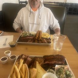 2 - 1/2 sheets mine; fatty brisket, ribs, dark meat chicken, broccoli salads.Husbands; fatty brisket, ribs, sausage, broccoli salad ,M&C