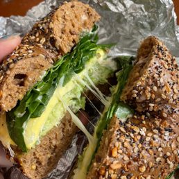 Spicy bagel with avocado instead of bacon, on multigrain whole wheat.
